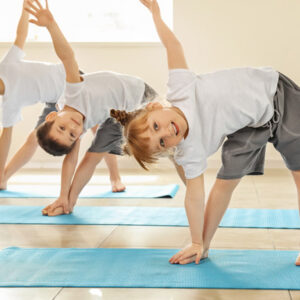 Group of kids demonstrating balancing yoga pose in body balance class